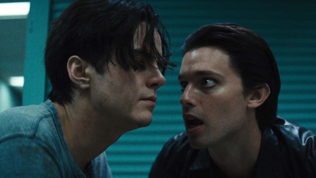 Daniel Isn't Real movie still. Two men face each other intensely. Adam Egypt Mortimer film.