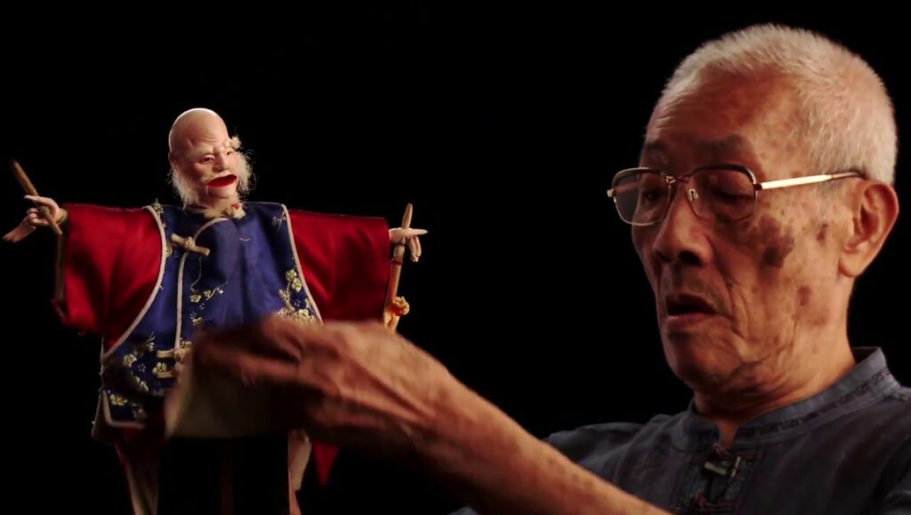 Father | Yang Li-chou Yang Li-chou's Father: Taiwanese puppeteer with puppet. Traditional Taiwanese puppetry art. Yang Li-chou performing.