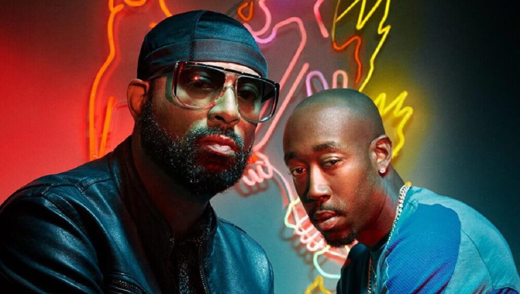 Freddie Gibbs & Madlib | Bandana Freddie Gibbs & Madlib, Bandana album cover. Rappers in front of neon lights. Hip-hop music duo.