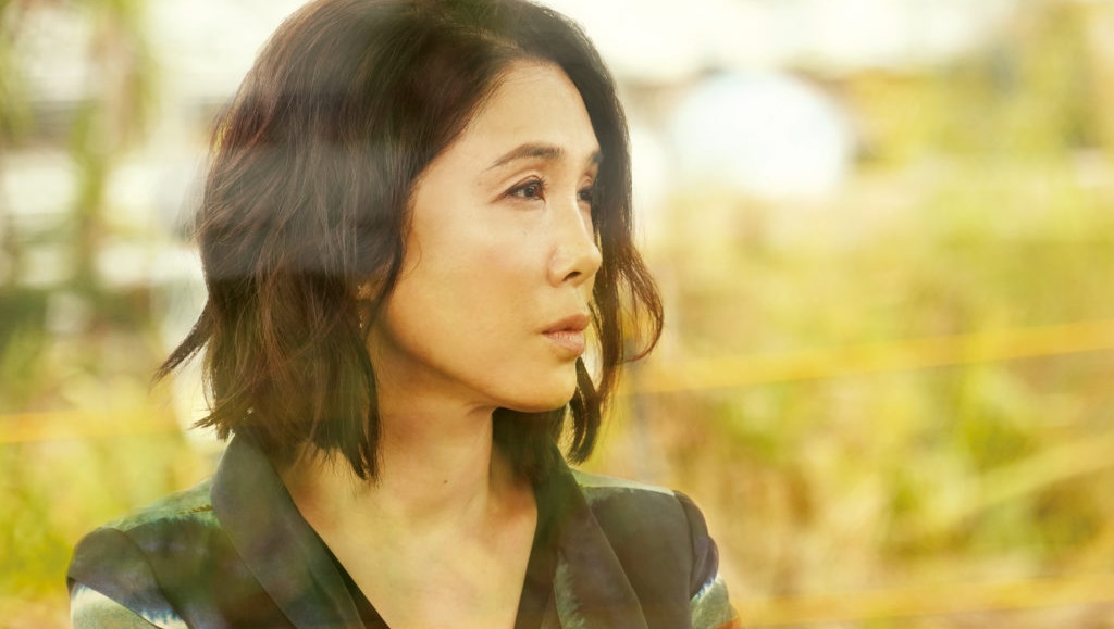 Still from Before We Vanish (2017). Woman with short hair looking off to the side. Japanese sci-fi film.