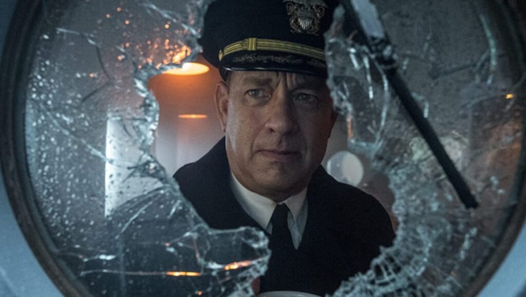 Greyhound | Aaron Schneider Tom Hanks in Greyhound movie. Captain Krause looks through broken glass. War film.