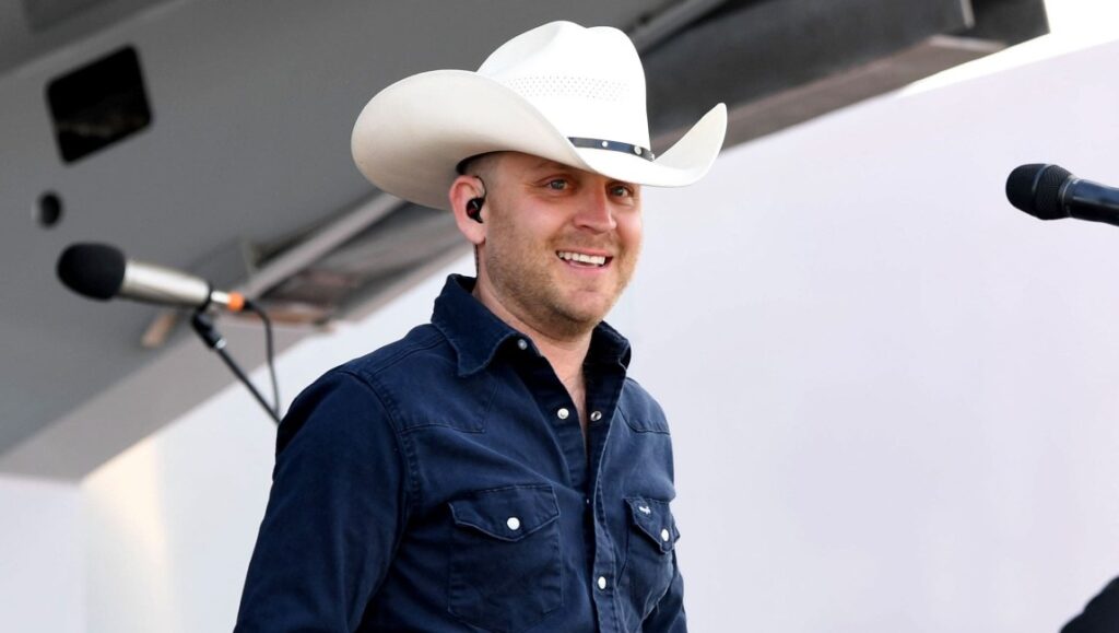 Justin Moore | Late Nights & Longnecks Justin Moore, Late Nights & Longnecks era. Country music singer with cowboy hat.