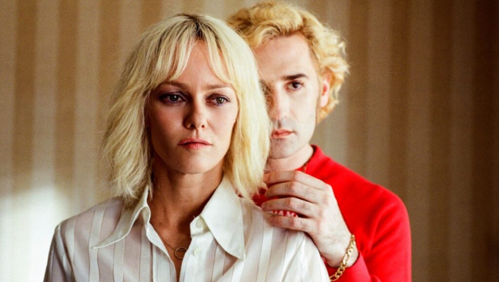 Knife + Heart | Yann Gonzalez Knife + Heart movie still: Vanessa Paradis and Nicolas Maury, blonde hair, red shirt, 1970s style. Yann Gonzalez film.