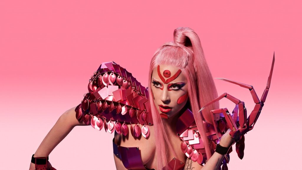 Pop Rocks | Q2 2020 Issue – Part 1: Lady Gaga, Haim, The Strokes Lady Gaga portrait. Pink hair, futuristic pink outfit, and claw-like hand accessory. Pop music icon.