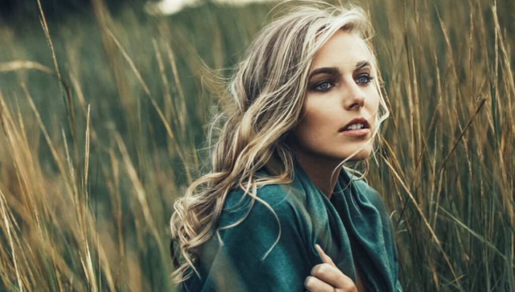 Lauren Jenkins | No Saint Lauren Jenkins, No Saint album art. Portrait of the singer with blonde hair in a field.