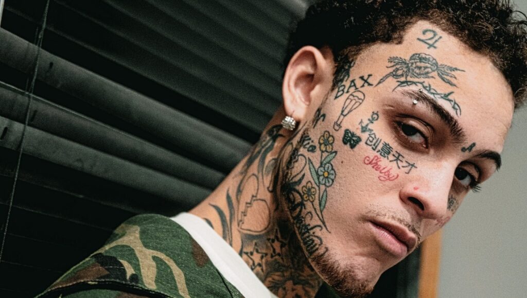 Lil Skies | Shelby Lil Skies, Shelby album art. Rapper with face tattoos, including Shelby. Camo jacket.