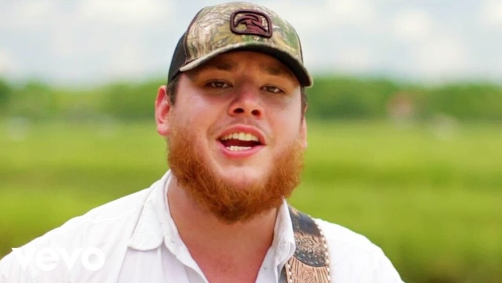 Luke Combs | The Prequel Luke Combs, The Prequel album art. Country music singer in camo hat against a green background.