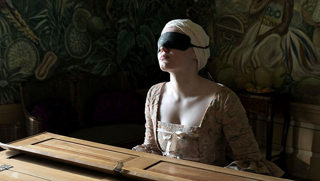 Mademoiselle Paradis | Barbara Albert Mademoiselle Paradis movie still. Blindfolded woman at piano. Barbara Albert film. Period drama.