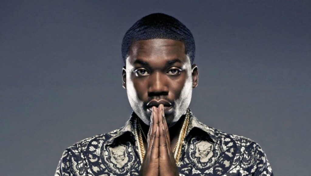 Meek Mill, the rapper, with hands together. Care for Me.