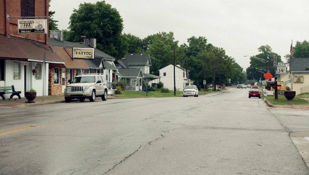 Monrovia, Indiana | Frederick Wiseman Monrovia, Indiana street view. Small town America, cars parked on the street, businesses and houses.