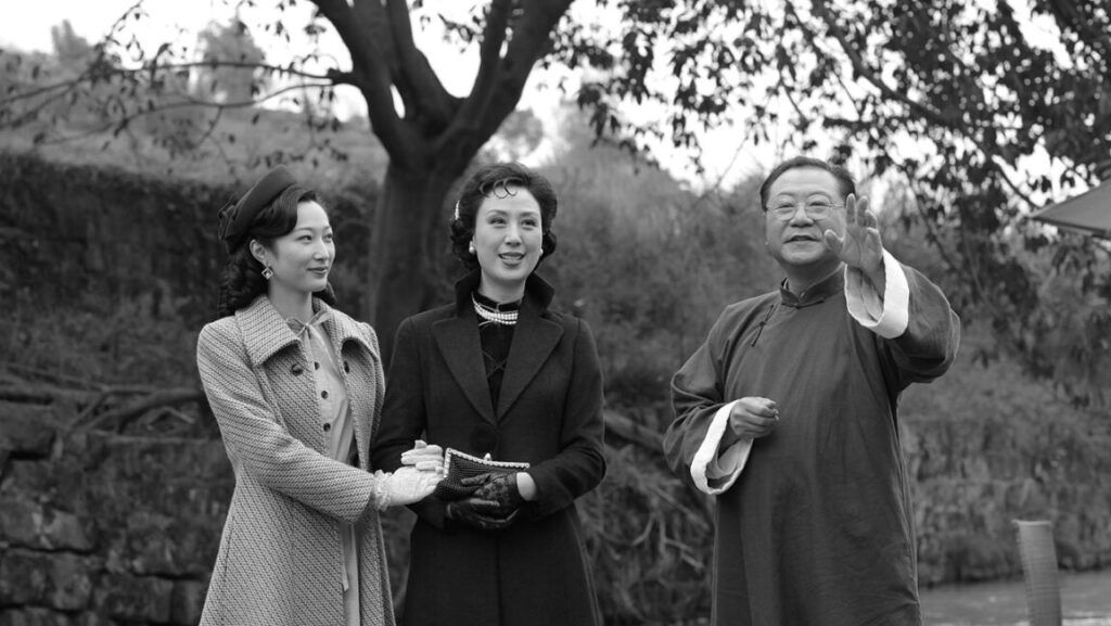 Mr. No Problem film still: Mei Fang with two other actors in period clothing. Black and white image.