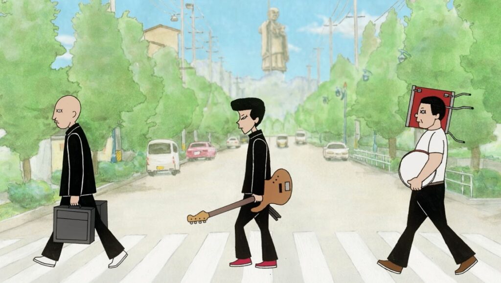 ON-GAKU: Our Sound | Kenji Iwaisawa ON-GAKU: Our Sound still. Three band members cross a street, one with a guitar, in Kenji Iwaisawa's animated film.