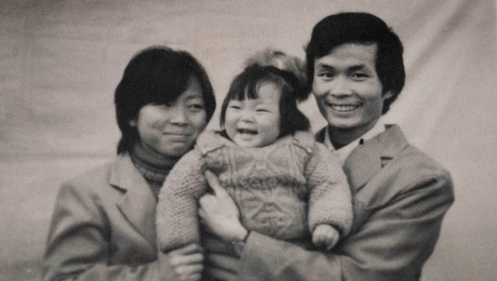 One Child Nation | Nanfu Wang & Jialing Zhang One Child Nation: Family portrait. Mother, father, and smiling baby. Nanfu Wang & Jialing Zhang film.