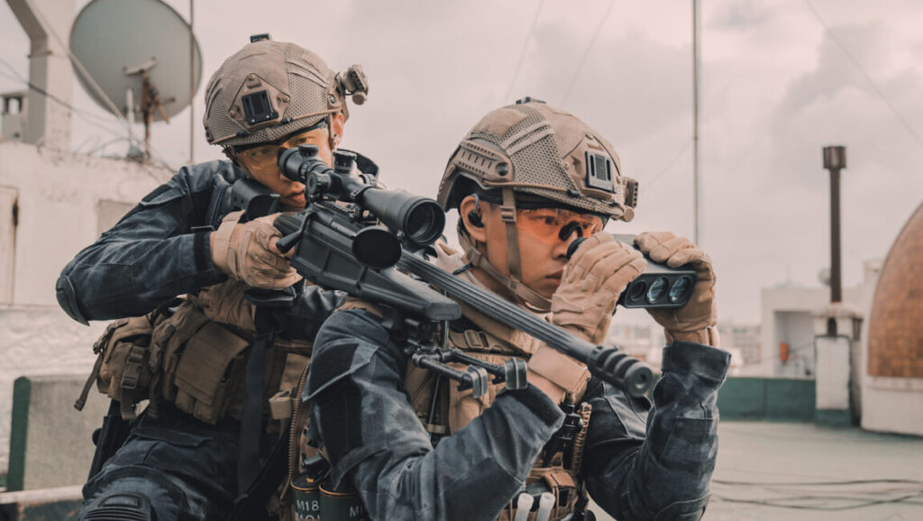 Operation Red Sea | Dante Lam Operation Red Sea: Two soldiers with sniper rifles on a rooftop, looking through scopes and binoculars.