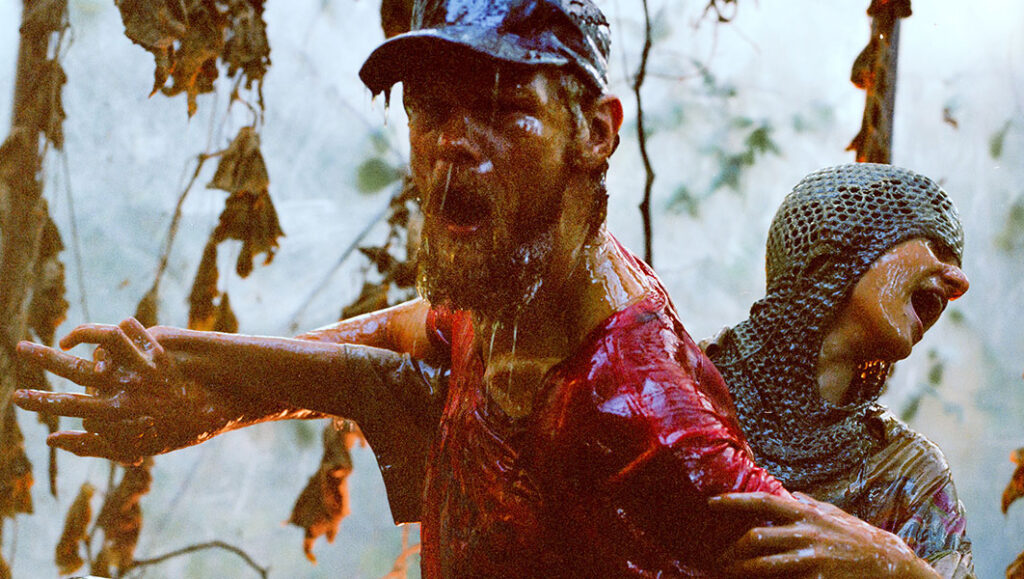 Resin | Daniel Borgman Daniel Borgman's Resin film still. Two resin-covered figures scream in distress in a forest setting.