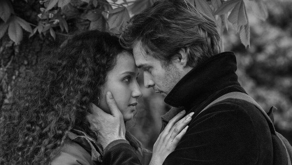 The Salt of Tears film still. Black and white image of a man and woman embracing. Romantic drama.