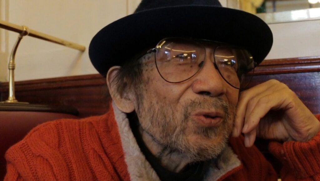 Seijo Story – 60 Years of Making Films | Isshin Inudo & Eiki Takahashi Seijo Japan Cuts 2020: Man in hat and glasses. Japan film festival coverage.