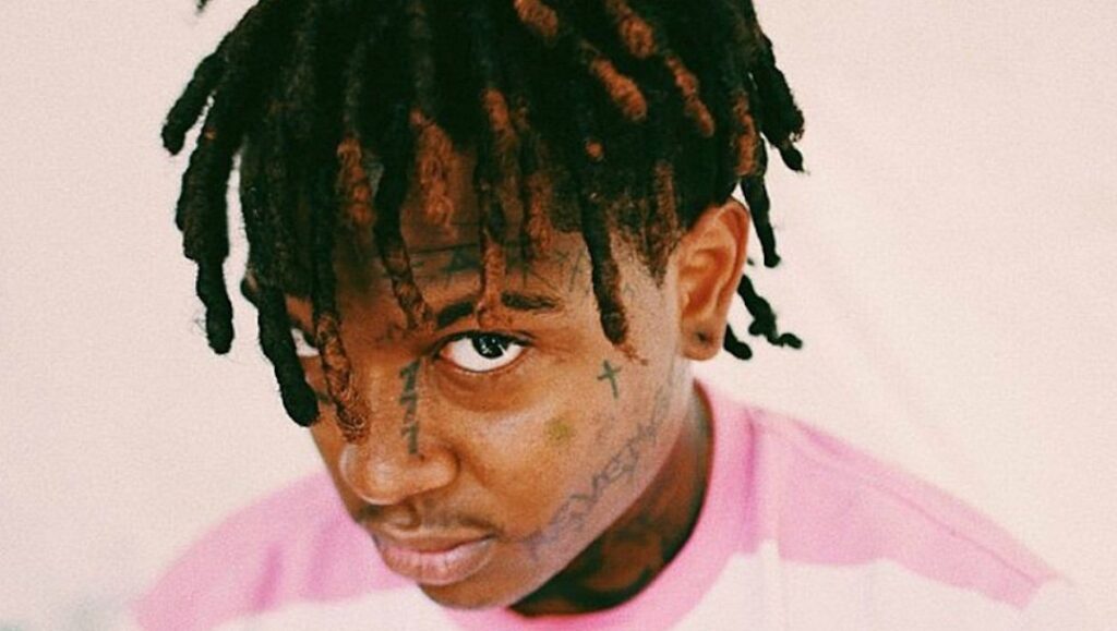 Ski Mask the Slump God | Beware the Book of Eli Saba Care for Me album art. Portrait of rapper with dreadlocks and face tattoos.