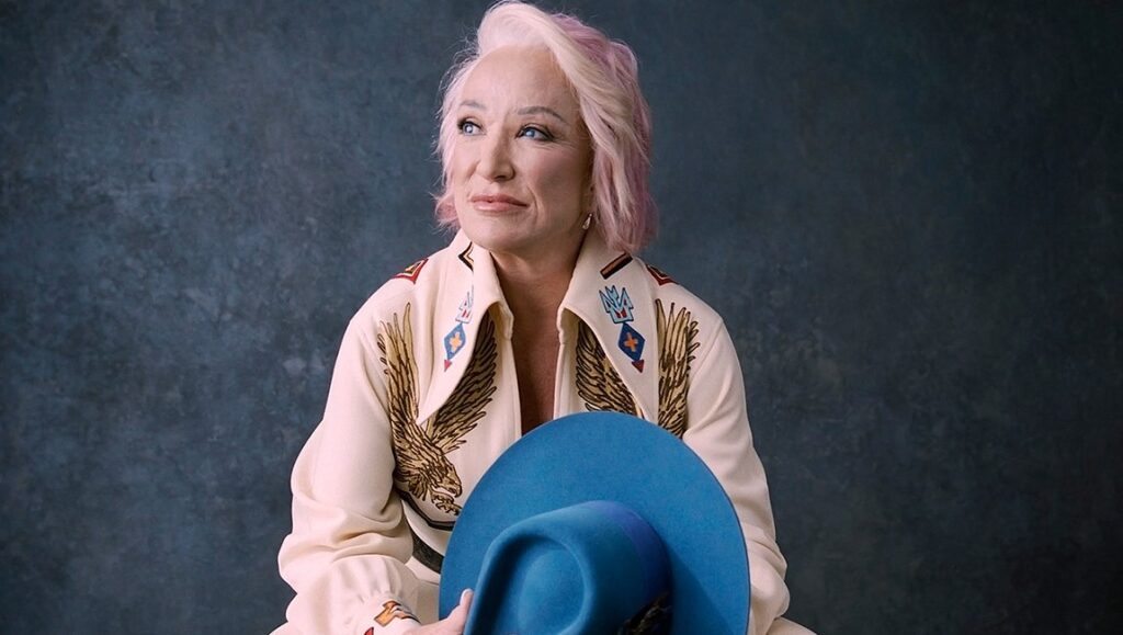 Tanya Tucker | While I’m Livin’ Tanya Tucker While I'm Livin' album art. Country music singer with cowboy hat.