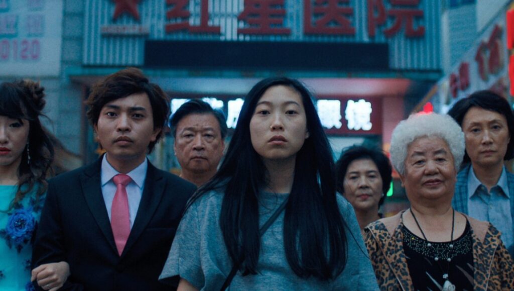 The Farewell movie still. Awkwafina with family in China. Lulu Wang film.