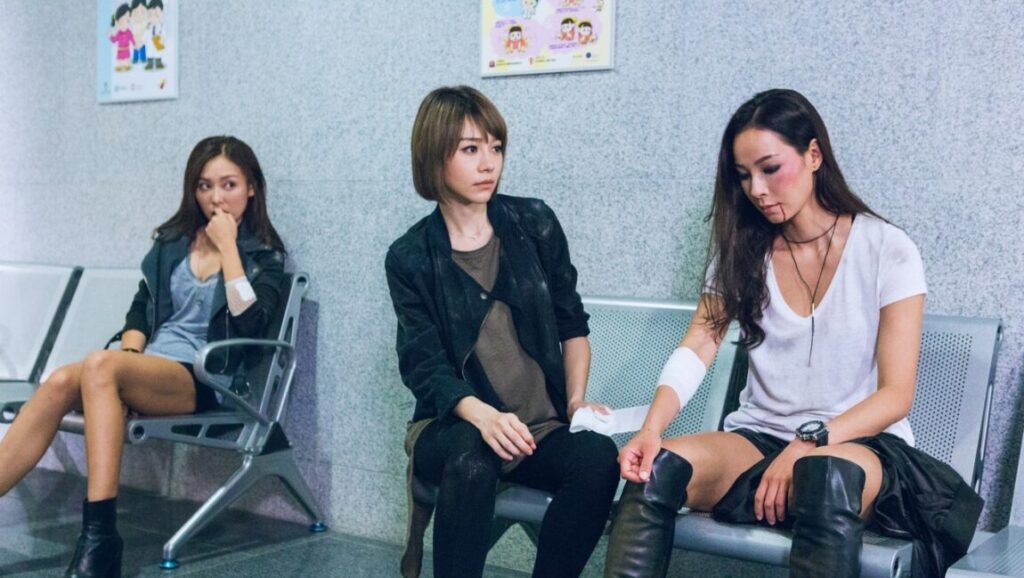 The Fatal Raid | Jacky Lee The Fatal Raid movie scene. Three injured women sit on chairs in a waiting room.