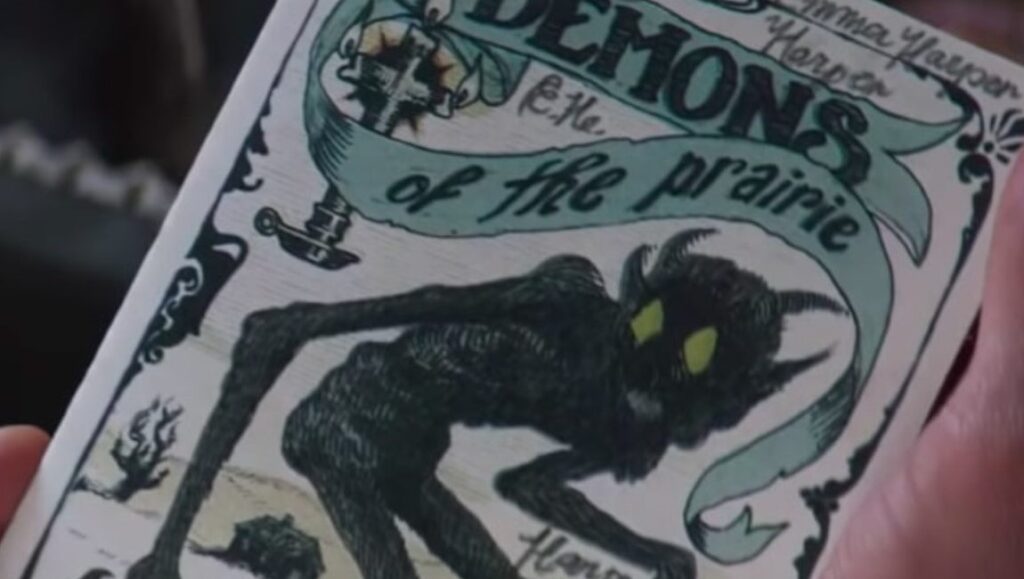 The Wind movie prop: Demons of the Prairie book cover with a prairie demon illustration.