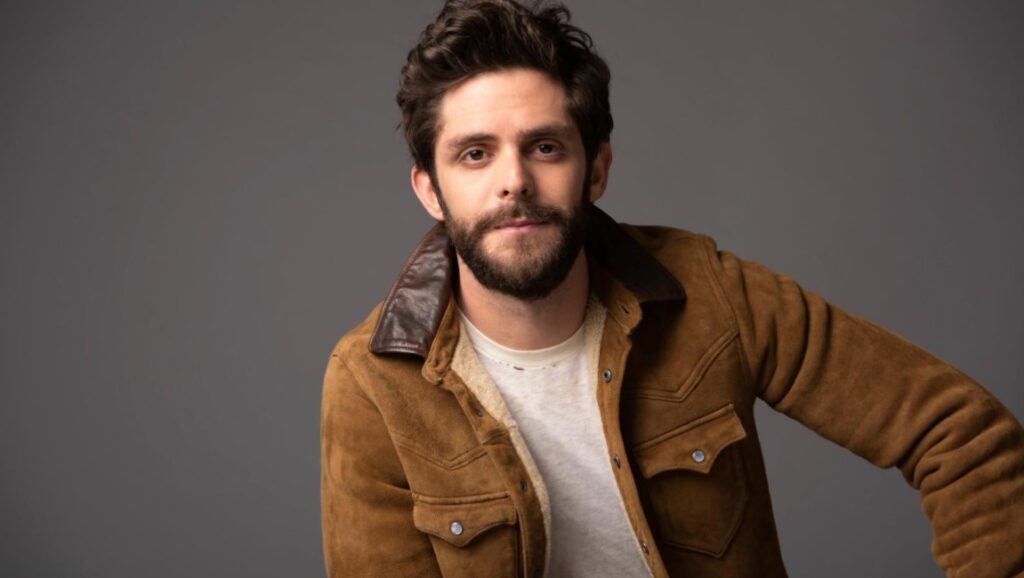 Thomas Rhett | Center Point Road Thomas Rhett, Center Point Road album. Portrait of the country music singer with a beard, wearing a brown jacket.