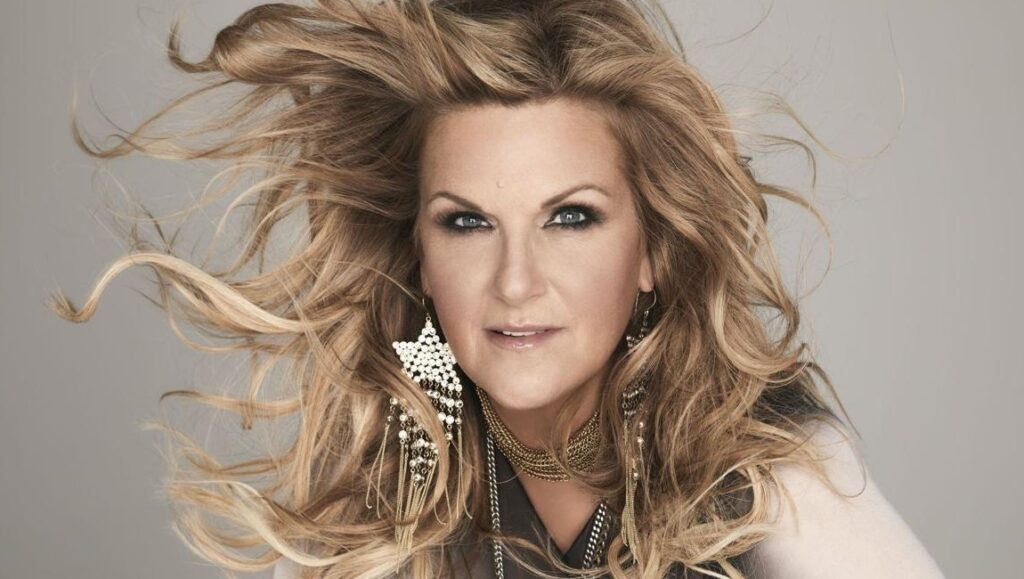 Trisha Yearwood, Every Girl album art. Country singer with flowing blonde hair and statement earrings.