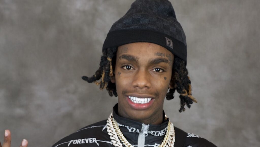 YWN Melly | We All Shine YWN Melly, We All Shine album art. Rapper with dreadlocks, beanie, and jewelry.