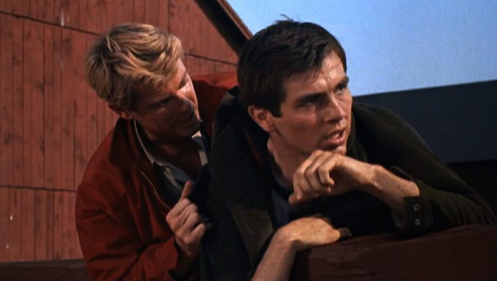 Escapes | Michael Almereyda Michael Almereyda's Escapes film still. Two men, one in red, the other in black, looking concerned.