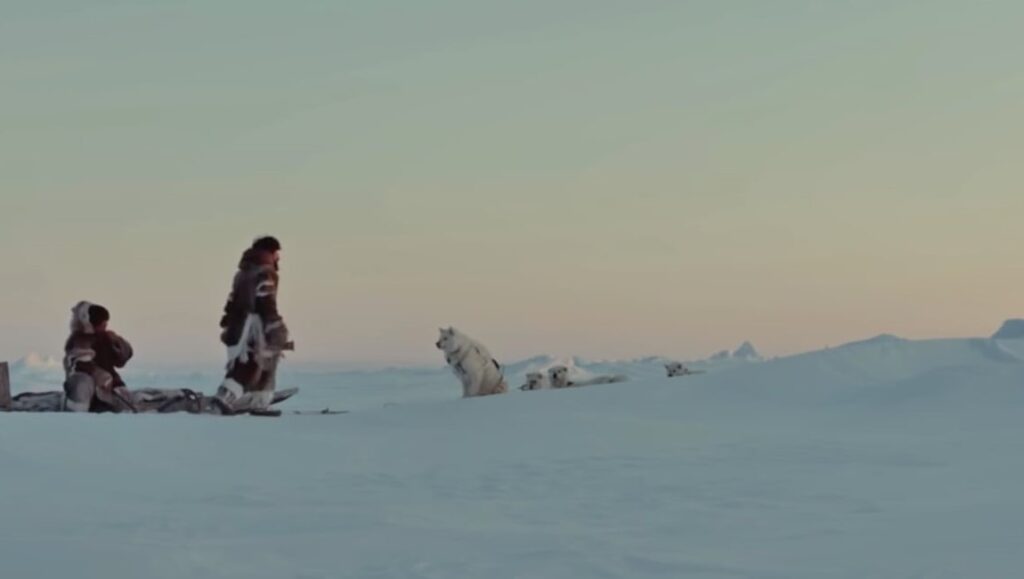 Maliglitut film still. Inuit family with dog sled team on Arctic ice. Zacharius Kunuk film.