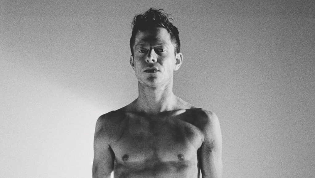 Perfume Genius | Set My Heart on Fire Immediately Perfume Genius portrait. Black and white shirtless photo for Set My Heart on Fire Immediately.