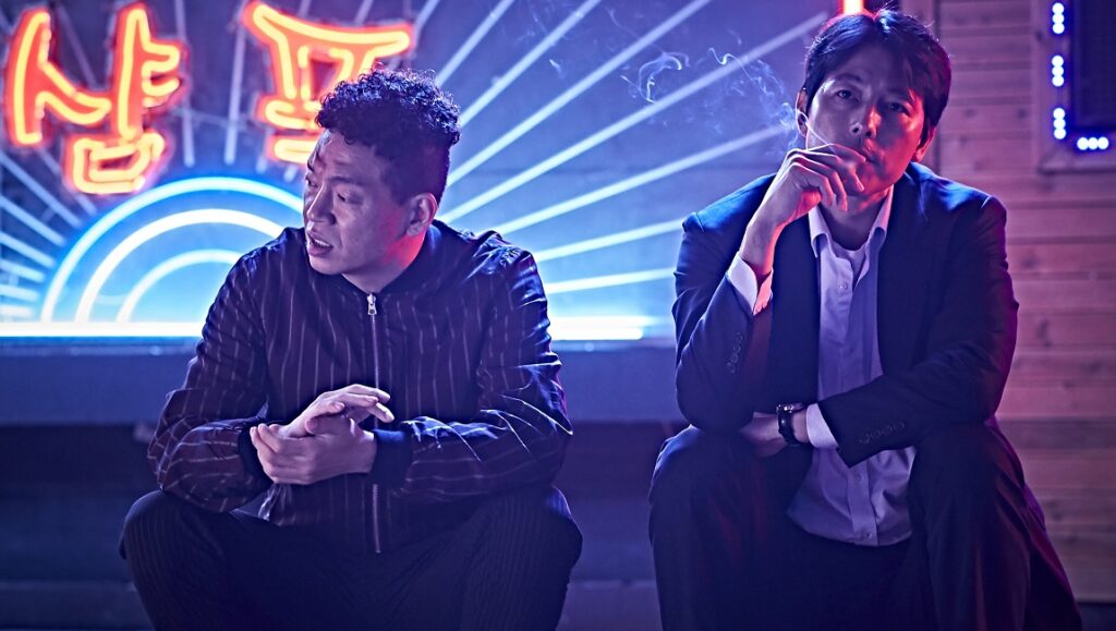 NYAFF 2020 — Dispatch 1: Beasts Clawing at Straws, Victim(s), My Prince Edward Beasts Clawing at Straws still. Two men sit under neon lights, one smoking. NYAFF 2020 Dispatch.