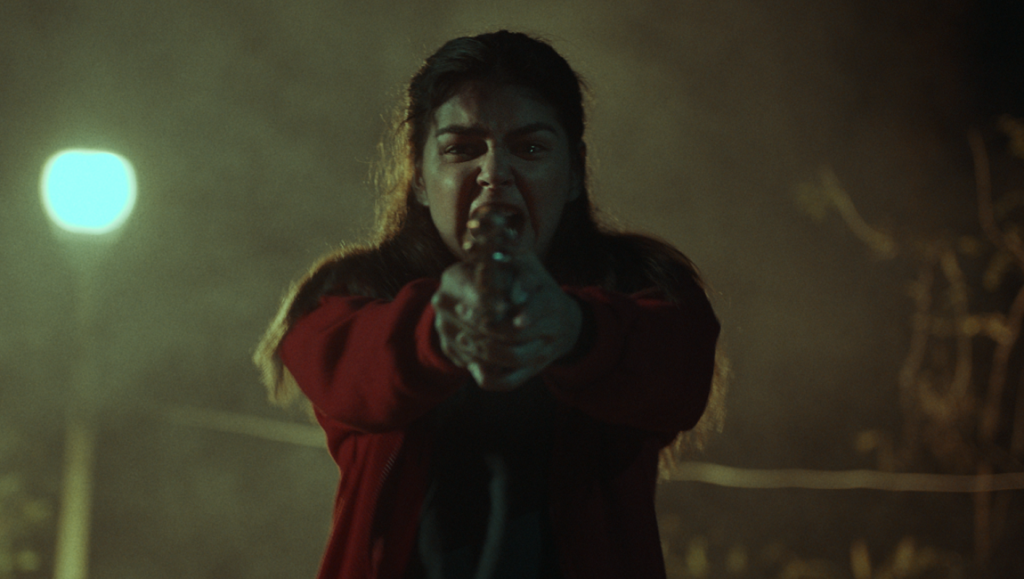 NYAFF 2020: The Girl and the Gun film still. Woman aiming a gun. Action, thriller, crime movie.