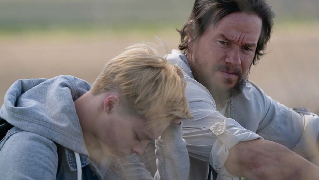 Joe Bell movie still: Mark Wahlberg and a young man. Reinaldo Marcus Green film.