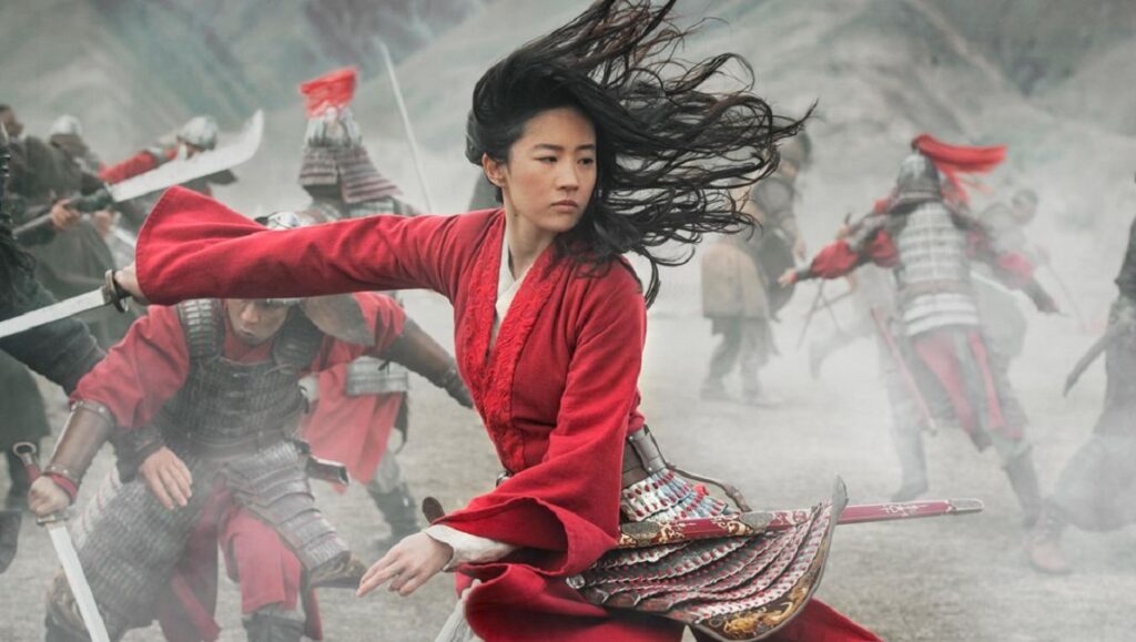 Liu Yifei as Mulan in Niki Caro's Mulan, wielding a sword in battle.
