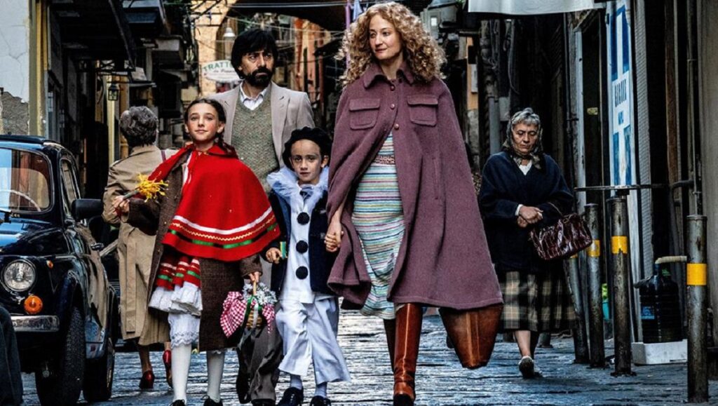 The Ties film scene at Venice Film Festival 2020. Family walking on street. Italian cinema.