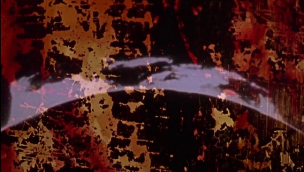 Abstract film still from Stan Brakhage's *Dog Star Man*, featuring textured layers and dark, earthy tones.