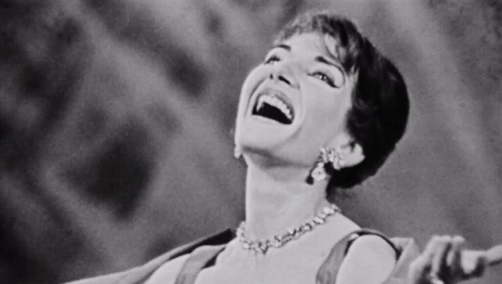 A Night at the Opera | Sergei Loznitsa Opera singer performing in A Night at the Opera. Black and white film still of a soprano singing with passion.