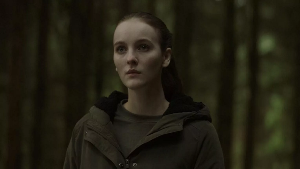 Rose Plays Julie | Christine Molloy & Joe Lawlor Rose Plays Julie film still. Ann Skelly as Rose/Julie in a forest setting. Dark, moody, and atmospheric.