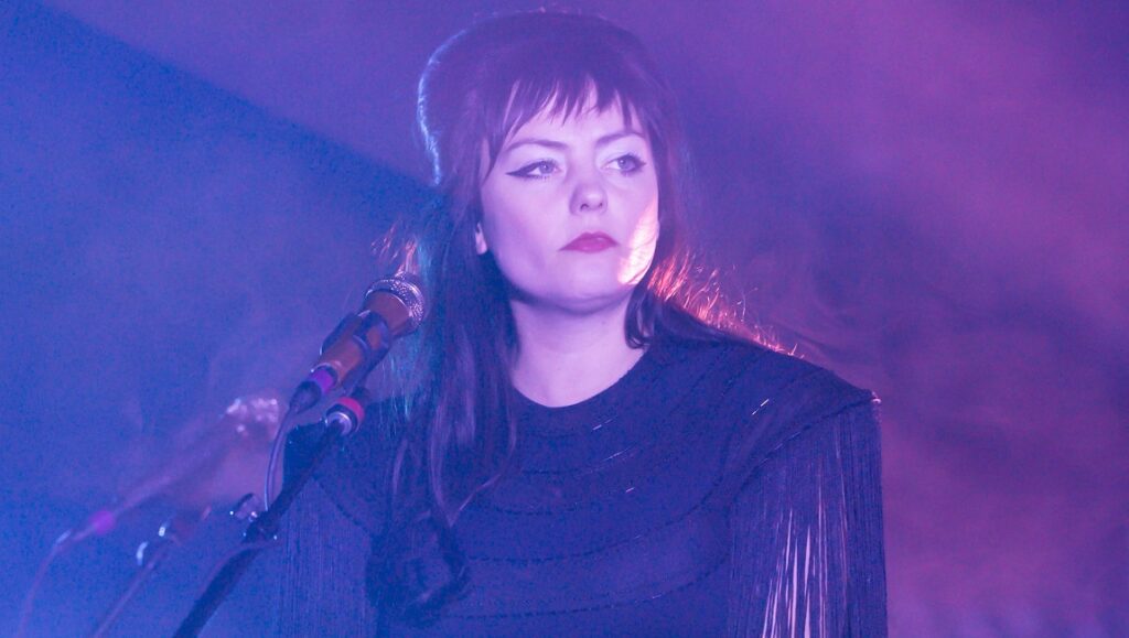 Angel Olsen | Whole New Mess Angel Olsen performing Whole New Mess. Singer in concert with microphone and stage lighting.