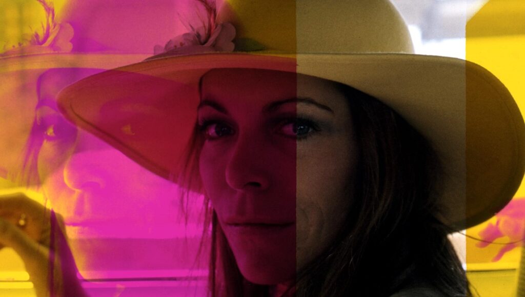 My Psychedelic Love Story image: Woman in hat with psychedelic color overlay, Errol Morris film.