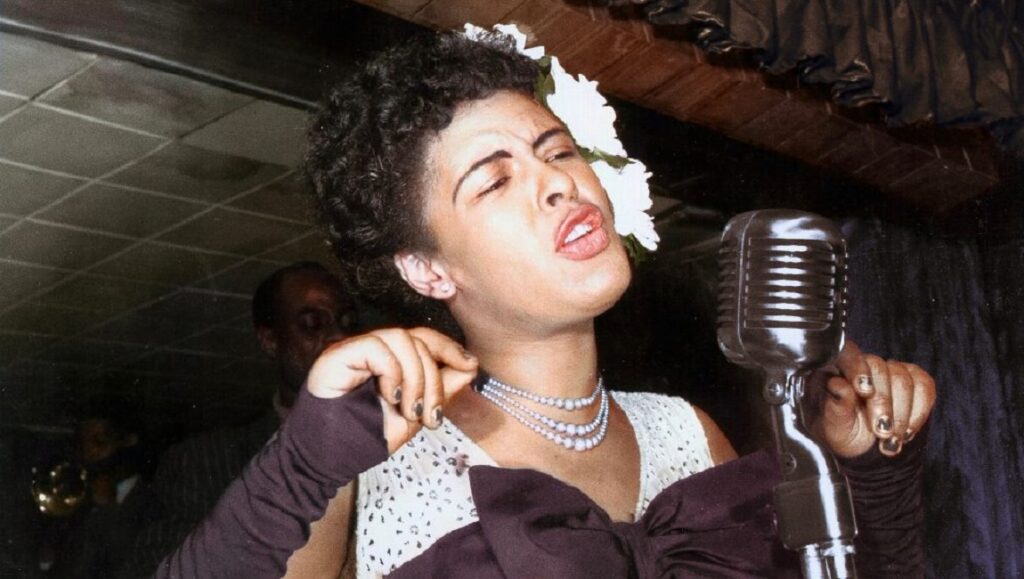 Billie Holiday sings into a vintage microphone. Jazz music legend.