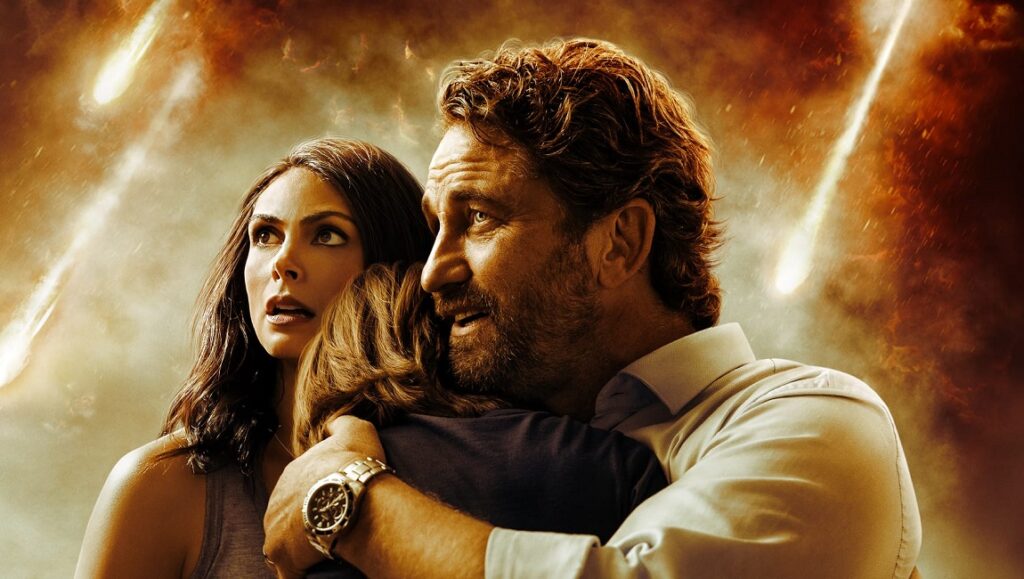 Greenland movie image: Gerard Butler family hugs during meteor shower. Disaster film.