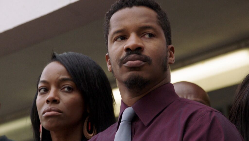 American Skin | Nate Parker Still from American Skin (2021). Actor Nate Parker wearing a tie.
