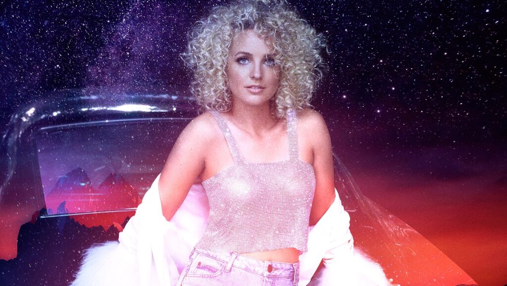 Cam from The Otherside album art. Singer with curly hair, pink top, and white fur coat against a starry sky.