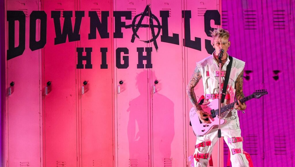 Downfalls High | Machine Gun Kelly & Mod Sun Machine Gun Kelly performing Downfalls High. MGK with guitar on stage. Pink lockers background.