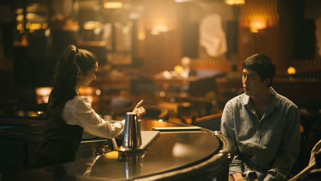 One for the Road | Nattawut Poonpiriya One for the Road at Sundance Film Festival 2021. Man at bar, bartender.