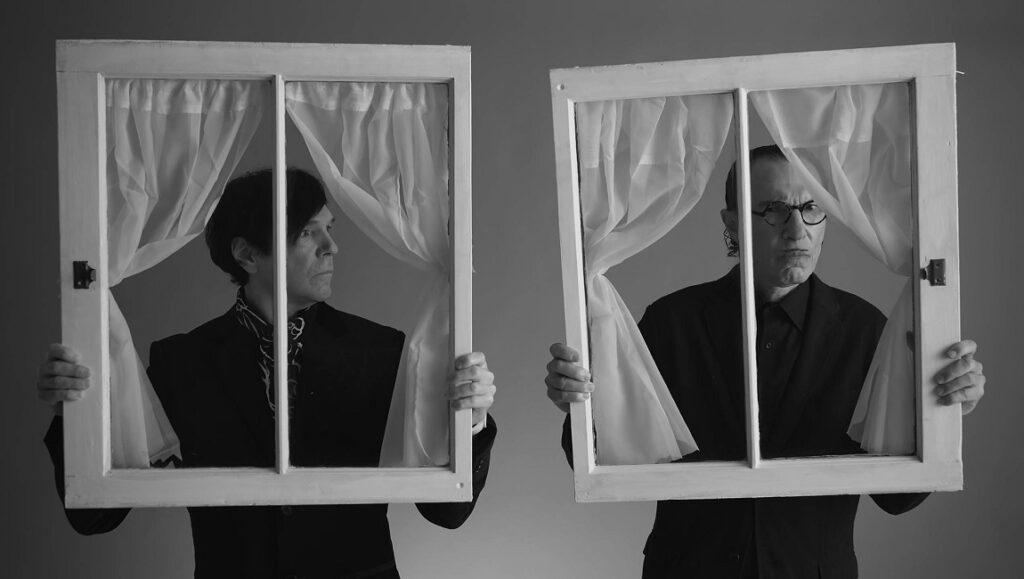 The Sparks Brothers | Edgar Wright Sparks Brothers Ron and Russell Mael in black and white holding window frames. Prime Time.