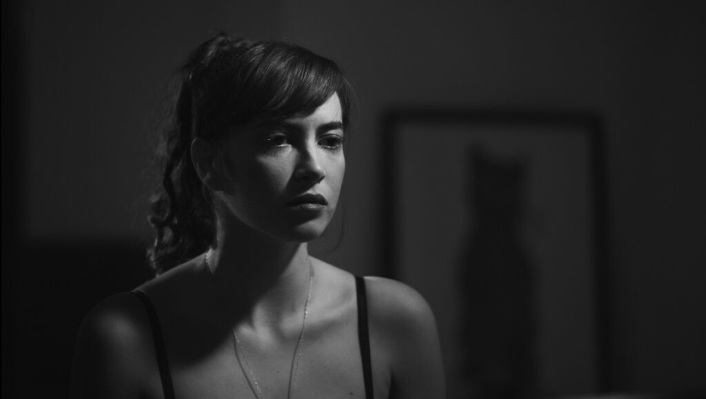 Black Medusa film still. Woman in black and white, IFFR 2021. Portrait.